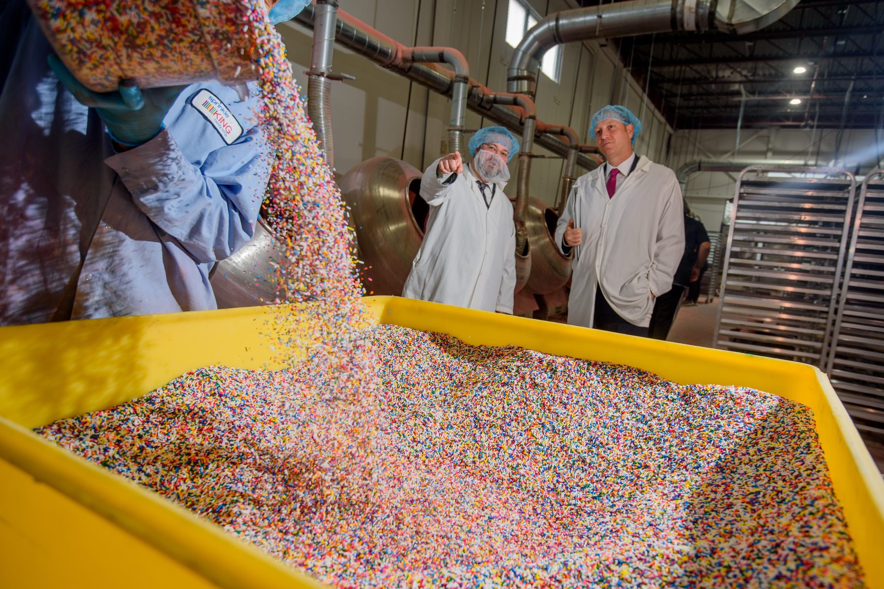 VegeCert inspectors reviewing an ingredient pour during a facility inspection