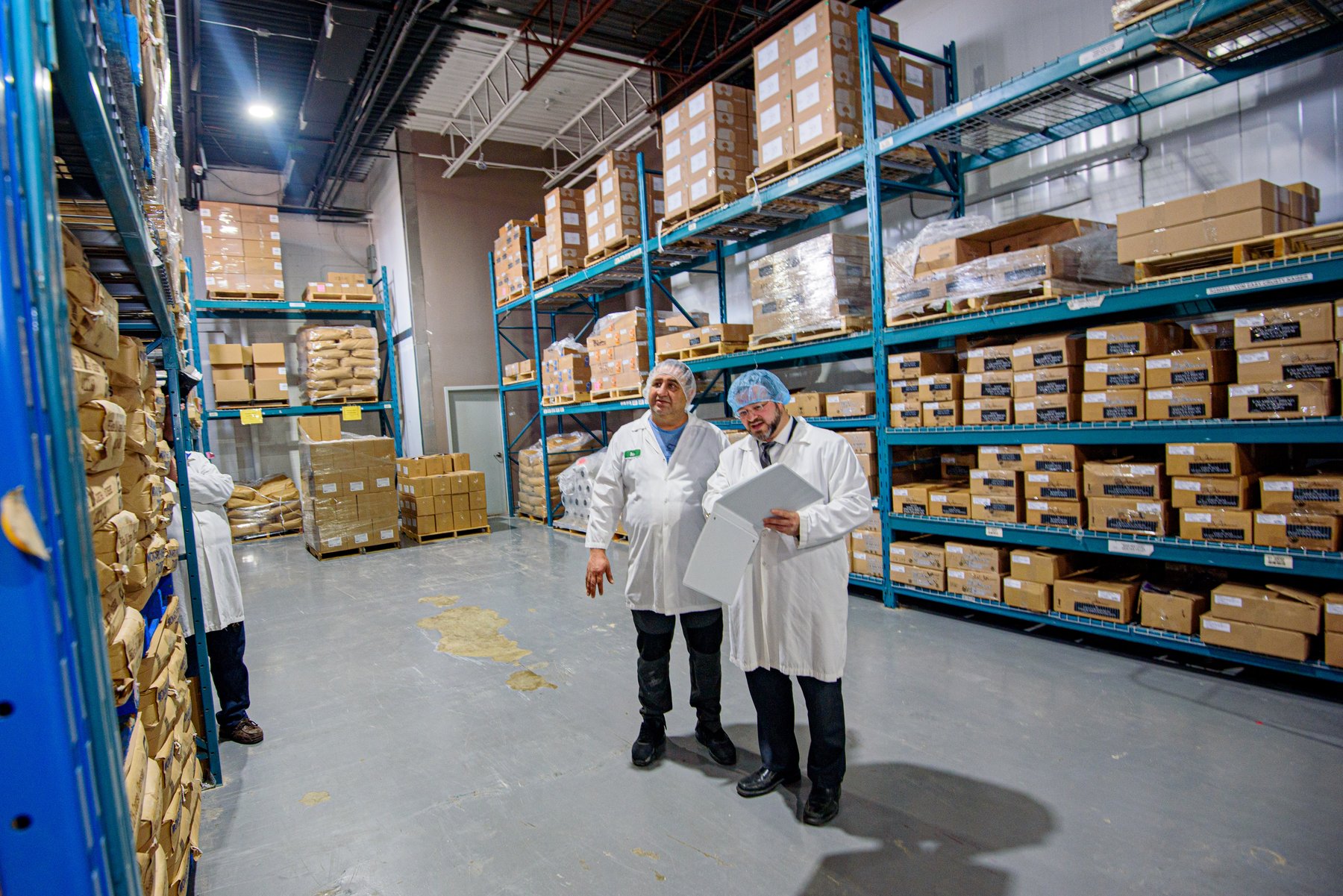 VegeCert staff reviewing inventory during a warehouse inspection